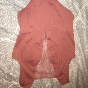 Bodysuit. Peach color